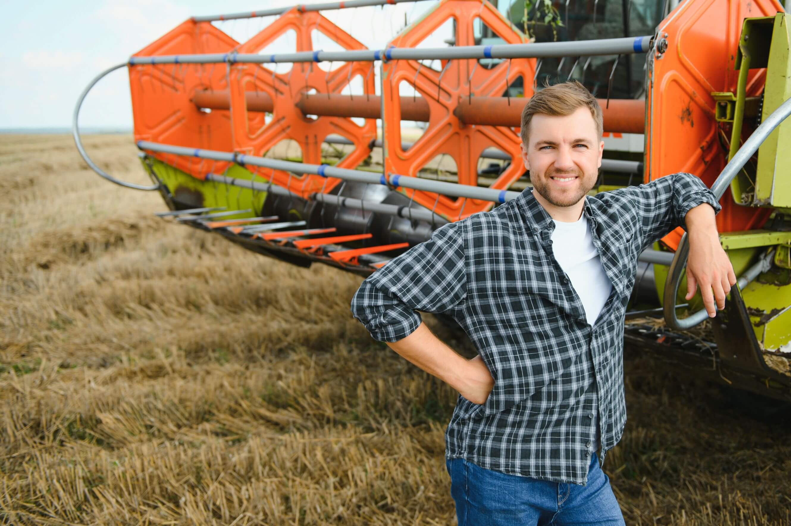 Farmer with combine harvester